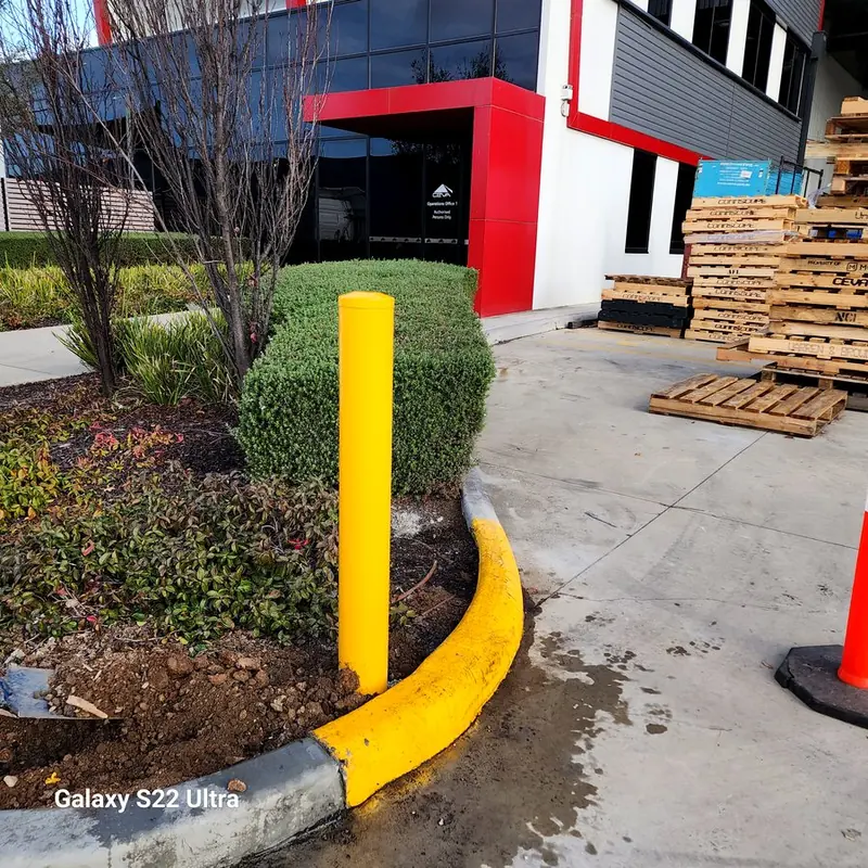 Yellow permanent bollard — CEVA logistics